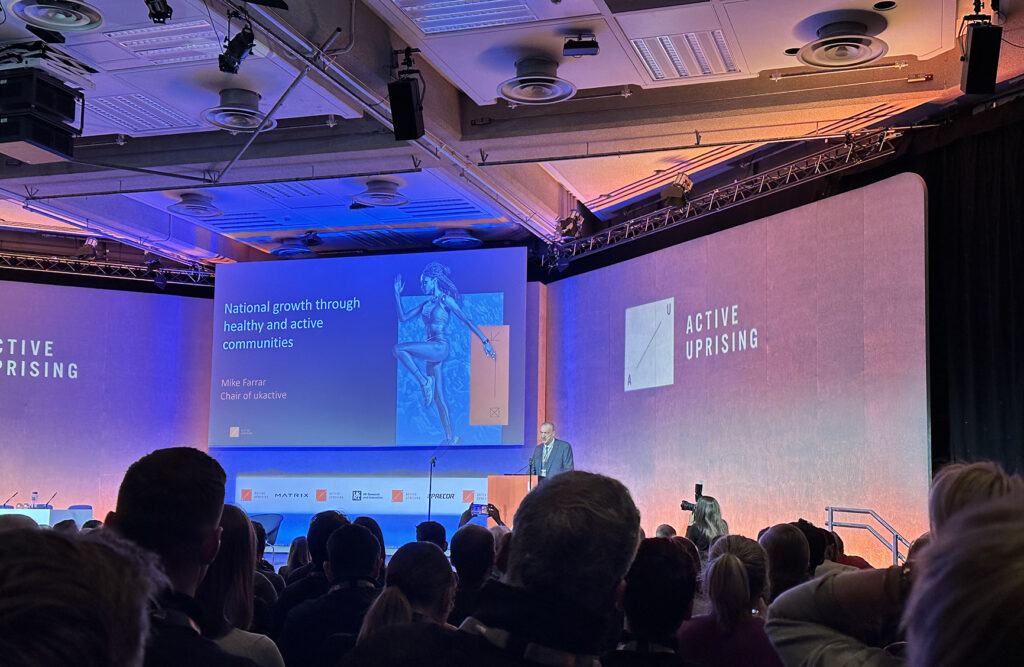 Photo of ukactive Active Uprising 2024 with Mike Farrar, Chair of ukactive, on stage