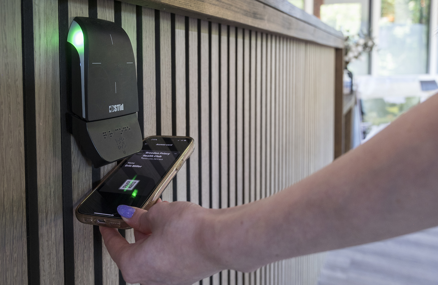 A photo of a member of Breedon Priory Health Club accessing the club using the integration between Technogym Mywellness CRM and Xplor Gym management software